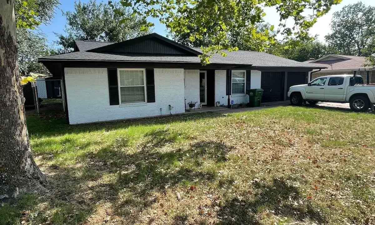Professional roofing crew working on a residential roof in Vestavia Hills